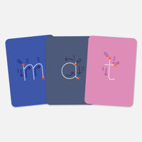 Three wipe-clean Writing cards showing how to form the letters m, a and t