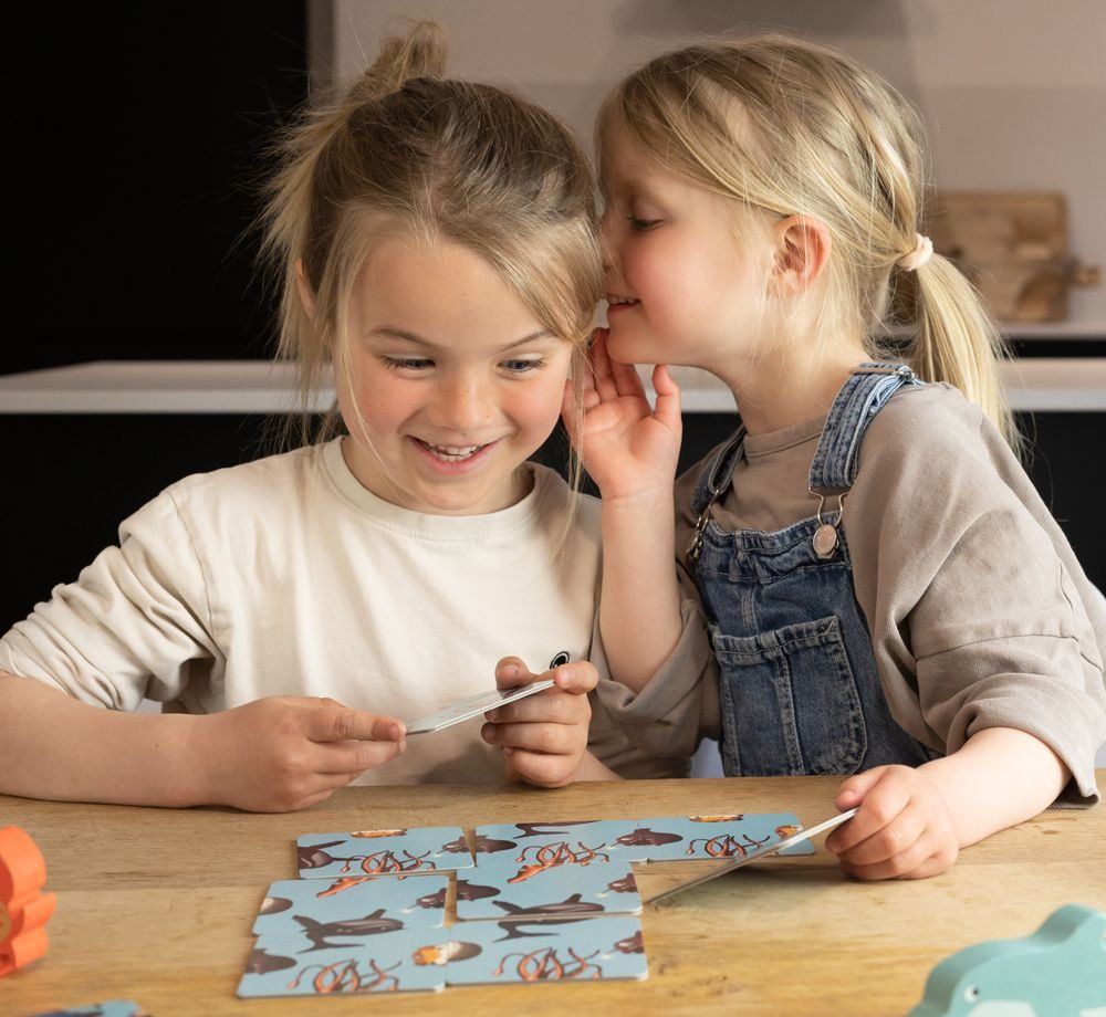 Child and parent learning at the kitchen table